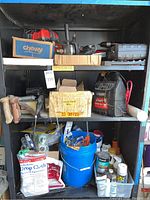 Shelving with assorted tools, Super Start Power Pack, buckets, drop cloths, painting supplies