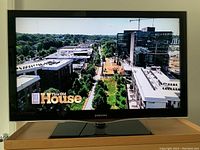 Samsung 40-inch LCD TV displaying an image of an outdoor building complex from "This Old House" show, showing good picture quality.