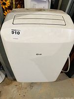 Front view of LG portable air conditioner showing brand logo and air outlet grille