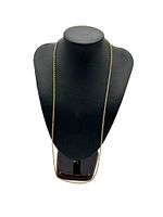 Chain displayed on black necklace bust to show length and drape