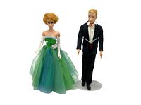 Front view of Barbie and Ken dolls, showing the Barbie's green and blue prom dress and the Ken's black tuxedo with red bow tie.