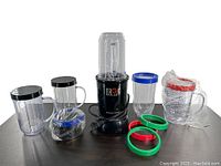 Photo of Magic Bullet Single Shot blender with multiple cups and colored ring bands
