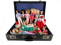 Front view of vintage suitcase containing multiple Barbie Heart Family dolls including adult and child figures dressed in original 1980s clothing.
