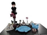 Photo showing all items including the wooden 'I Love Shoes' figure, bisque vases, ceramic fish plate, ceramic hen soap dish, glass hen trinket box, figurines assorted on a flat surface.