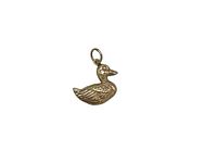 Photo of the duck-shaped gold charm from the front showing texture details and attachment loop.