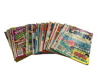 Photo showing a large pile of vintage Archie comic books including Pep, Laugh, Josie, Jughead, Betty and Veronica among others, all in used condition.