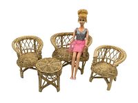 The full set including the Mod Francie doll seated on a loveseat with the two single chairs and round table arranged around her.