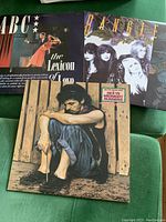 Photo of three LP vinyl record covers showing ABC's 'The Lexicon of Love', Bangles, and Dexys Midnight Runners with distinct cover art.