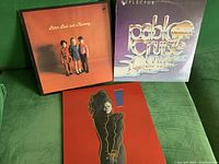 Front cover view of Peter, Paul and Mommy LP, Pablo Cruise Reflector LP, and Janet Jackson LP on green couch.