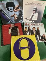 Photo of all 5 LP albums together showing covers from Burton Cummings, Long John Baldry, Haywire, Doug and the Slugs, and Loverboy.