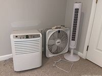 Photo showing the Zenith dehumidifier alongside the two fans.