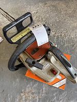 Overview of chainsaw body and handle