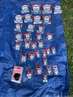 Overview of 31 Milwaukee hole saws displayed on a blue tarp