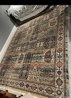 Full view of rectangular rug laid on carpeted floor