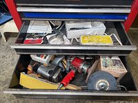 Drawer with Marc air powered tool, Chicago Pneumatic sander, sanding discs, and accessories.