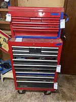 Front view of stacked top chest and bottom rolling cabinet showing drawer layout and overall appearance