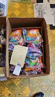 Box containing rows of individually packaged McDonald's TY collectible toys, each package showing the McDonald's golden arches and numbers 1 through 12 or 18 printed on them.