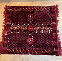 Overview of the rug laid flat on the floor, showing full pattern and color tones.