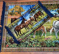 Smaller velvet horse rug/tapestry featuring multiple horses lined up against a sunset sky with fringed edges and decorative border.