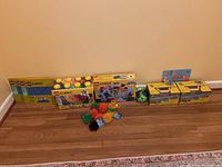 All items arranged on floor against wall