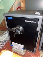 Front view of Sentry safe showing digital keypad, key lock, and handle.
