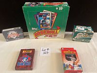 Photo of 1990 Topps Baseball box, Upper Deck All-Star FanFest box, Japanese Tigers box, Blue Jays Oh Henry! deck, and 1987 Topps Traded Series box and packs.