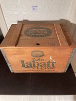 Front side of wooden case showing John Labatt Classic Special Extra Aged logo and text