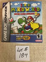 Front of Super Mario World: Super Mario Advance 2 GameBoy Advance box featuring Mario riding Yoshi over a green pipe and colorful game title.