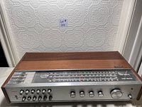 Front view of vintage Philips 790 receiver with wood top and sides, metal front panel showing tuning dial, frequency indicator, and control knobs.