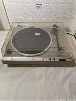Full view of Hitachi DC Servo Turntable model HT-20S with dust cover closed showing general condition and dust cover details.