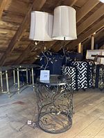 Full view of the side table with two matching lamps on top, showing height and overall design.