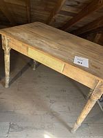 Full view of the antique wood table showing the worn tabletop and front drawer front with distressed shabby chic finish.