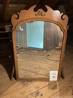 Full view of vintage Chippendale style mirror showing maple wood frame and carved shell motif at the top center.