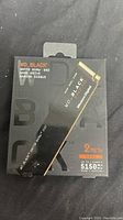 Front of box showing WD Black SN770 branding, 2TB capacity, and Gen4 PCIe.