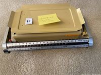 Biserka mechanical weight scale shown with visible sliding weight indicators and measurement scale up to 10 kg.