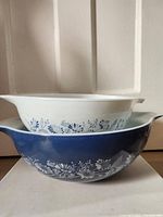 Stacked mixing bowls showing Colonial Mist floral pattern.
