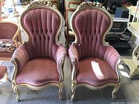 Two pink Louis XVI style chairs side by side showing overall appearance and matching pair