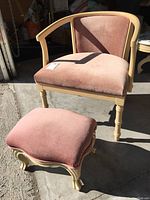 Full view of pink barrel back occasional chair and matching footstool showing overall condition and style.