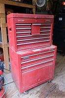 Exterior front view of two-piece red Craftsman tool chest showing top chest and bottom rolling cabinet