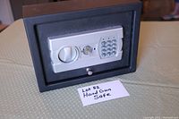 Front view of the handgun safe showing electronic keypad, silver handle, and key slot