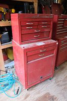 Red metal tool chest setup with larger rolling base chest and smaller chest on top