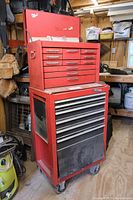 Red two-piece Craftsman rolling tool chest with multiple drawers on casters