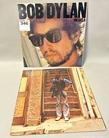 Front covers of two Bob Dylan albums "Infidels" and "New Morning" on display.