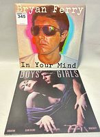 Front cover of Bryan Ferry 'In Your Mind' album with Bryan Ferry's portrait in sunglasses and 'Boys and Girls' album cover showing Bryan Ferry with two female figures.