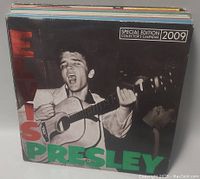 Photo of Elvis Presley 2009 Special Edition Collector's Calendar box with black and white image of Elvis playing guitar