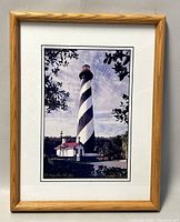 Front view of framed photograph showing the St. Augustine Lighthouse with signature and matting.