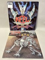 Front covers of the Keel and Russ Ballard vinyl record albums showing artwork and titles.