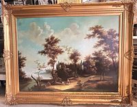 Front full view of the large framed oil painting showing landscape scene with trees, figures, and castle-like buildings in background.