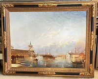 Front view of ornately framed painting depicting Venetian canal scene