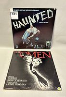 Front covers of The Omen and Haunted soundtrack vinyl albums showing titles and cover art.